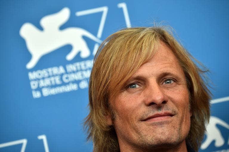 US actor Viggo Mortensen poses during the photocall of the movie "Far From Men" presented in competition at the 71st Venice Film Festival on August 31, 2014 at Venice Lido