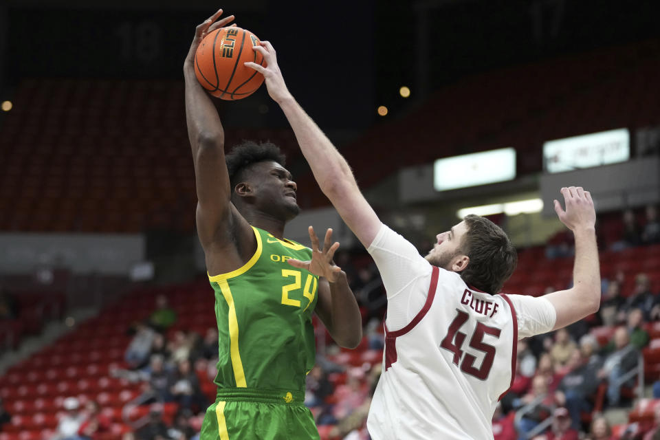 Oregon center Mahamadou Diawara (24) is blocked by Washington State forward Oscar Cluff (45) during the first half of an NCAA college basketball game Saturday, Jan. 6, 2024, in Pullman, Wash. (AP Photo/Ted S. Warren)