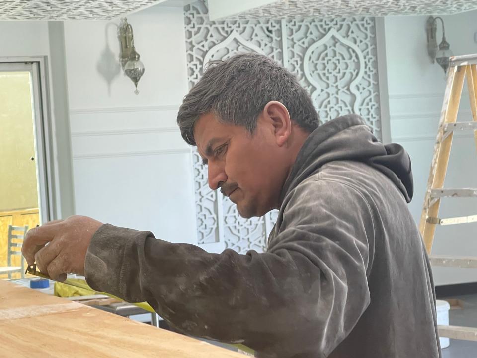 A construction worker inside Ala' Al-Deen, or Aladdin restaurant in Victorville. The owners said the eatery should open sometime in April.