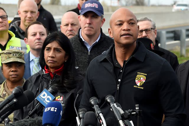 <p>Barbara Haddock Taylor/The Baltimore Sun/Tribune News Service via Getty</p> Governor Wes Moore speaks at a news conference at the Maryland Department of Transportation campus near the bridge. Lt. Governor Aruna Miller is on left; Baltimore County Executive Johnny Olszewski is behind them, as well as Senate President Bill Ferguson.