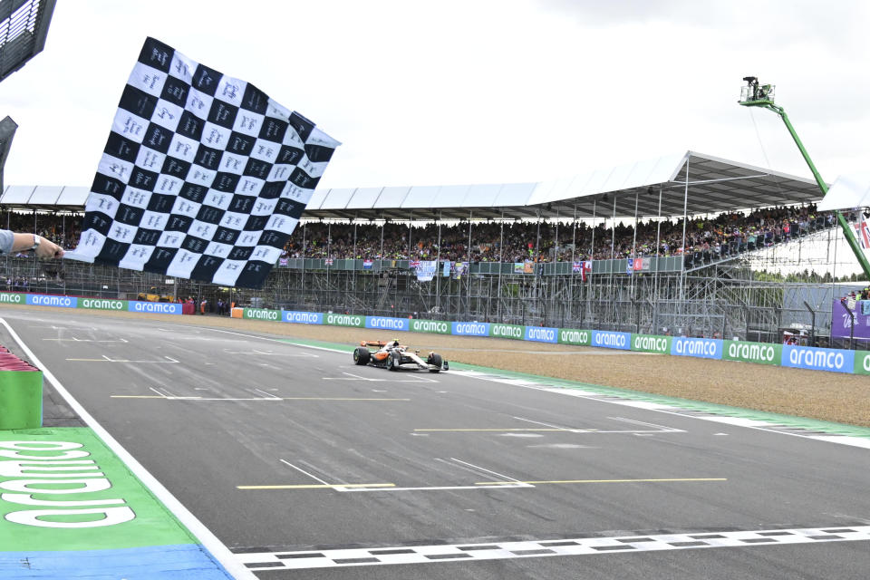 McLaren driver Lando Norris of Britain crosses the finish line to place second at the British Formula One Grand Prix race at the Silverstone racetrack, Silverstone, England, Sunday, July 9, 2023. (Christian Bruna/Pool photo via AP)