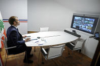 France's President Emmanuel Macron attends an international video conference at the Fort de Bregancon, in Bormes-Les-Mimosas, southern France, Wednesday, Aug. 4, 2021. The virtual event, co-hosted by France and the United Nations, is meant to show support towards Lebanese people, French President Emmanuel Macron said. France will provide 100 millions euros ($118.6 million) in the coming months, Macron said in his opening remarks. (Christophe Simon/Pool Photo via AP)