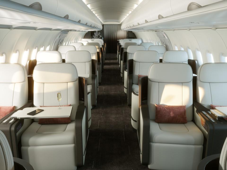 inside the four seasons private jet with cream colored loungers.
