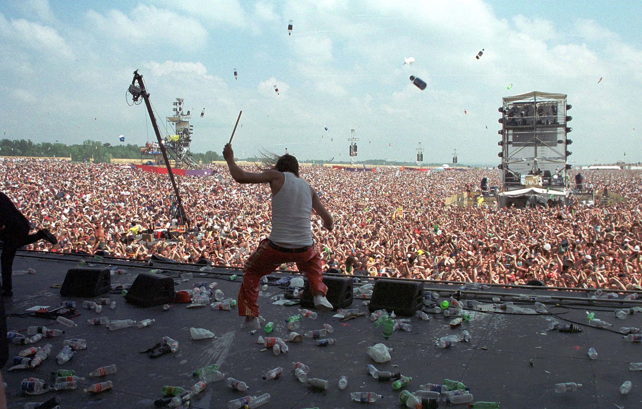 Kid Rock on stage before a crowd.