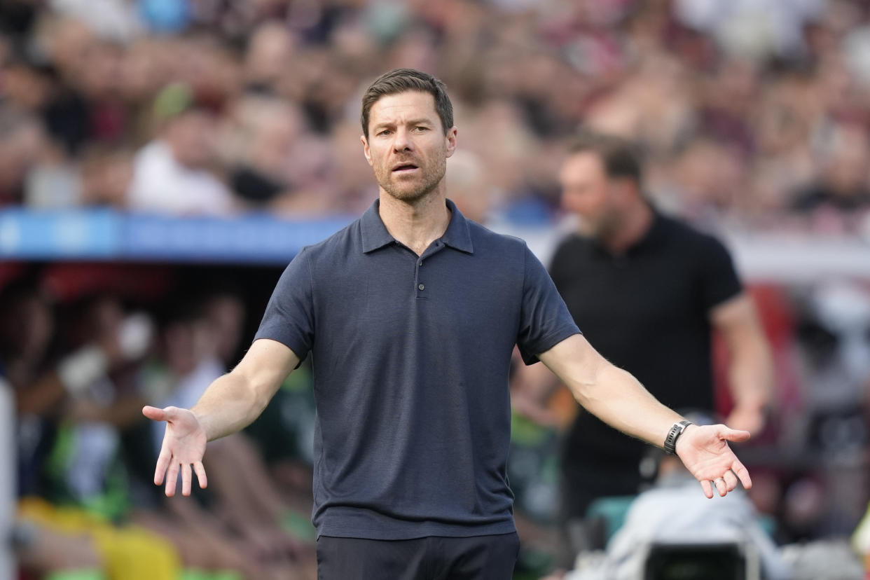 Leverkusen's head coach, Xabi Alonso reacts during the German Bundesliga soccer match between Bayer Leverkusen and VfL Wolfsburg at the BayArena in Leverkusen, Germany, Sunday, Sept. 22, 2024. (AP Photo/Martin Meissner)