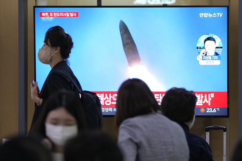 FILE - A TV screen shows a file image of a North Korean missile launch during a news program at the Seoul Railway Station in Seoul, South Korea, Wednesday, Sept. 28, 2022. South Korea says late Thursday, Sept. 29, 2022, that North Korea has fired another missile toward its eastern waters, in the third round of launches this week. (AP Photo/Ahn Young-joon, File)