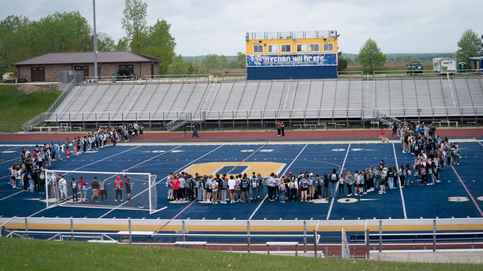 Oxford High School students walk out of classes to the football field on May 26, 2022, to show their support for the Uvalde Texas community and the recent mass shooting that occurred at an elementary school.