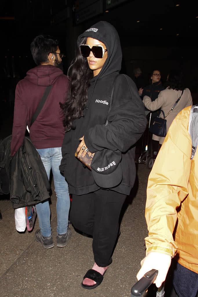 <p>Rihanna seen at LAX in a $1,052 Vetements sweatshirt. <i>(Photo: Getty Images)</i> </p>