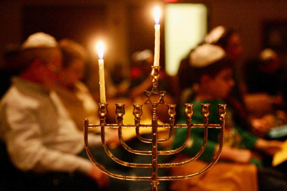A lighted menorah rests on the table as Congregation Beth Israel in Colleyville marks the beginning of Chanukah on Dec. 11, 2009.