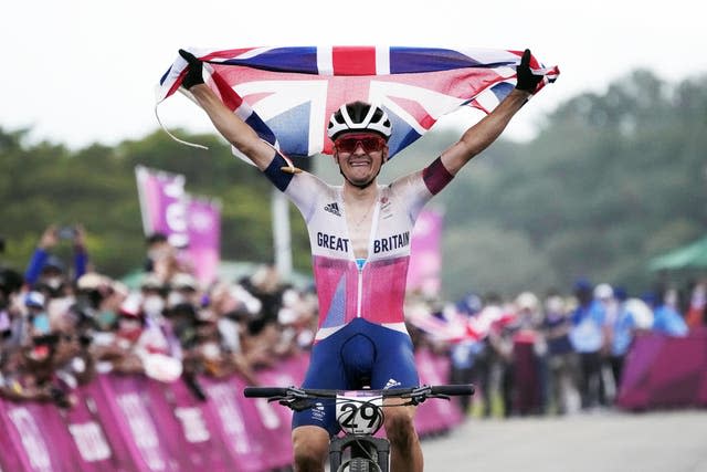 Tom Pidcock celebrating on his bike