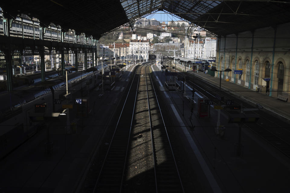 Railways are deserted at the Lyon Perrache train station, in Lyon, central France, Tuesday, Jan. 31, 2023. France's national rail operator is recommending that passengers stay home Tuesday to avoid strikes over pension reforms that are expected to cause major transport woes but largely spare high-speed links to Britain, Belgium and the Netherlands. Labor unions are hoping to maintain pressure on government plans to raise France's retirement age. (AP Photo/Laurent Cipriani)