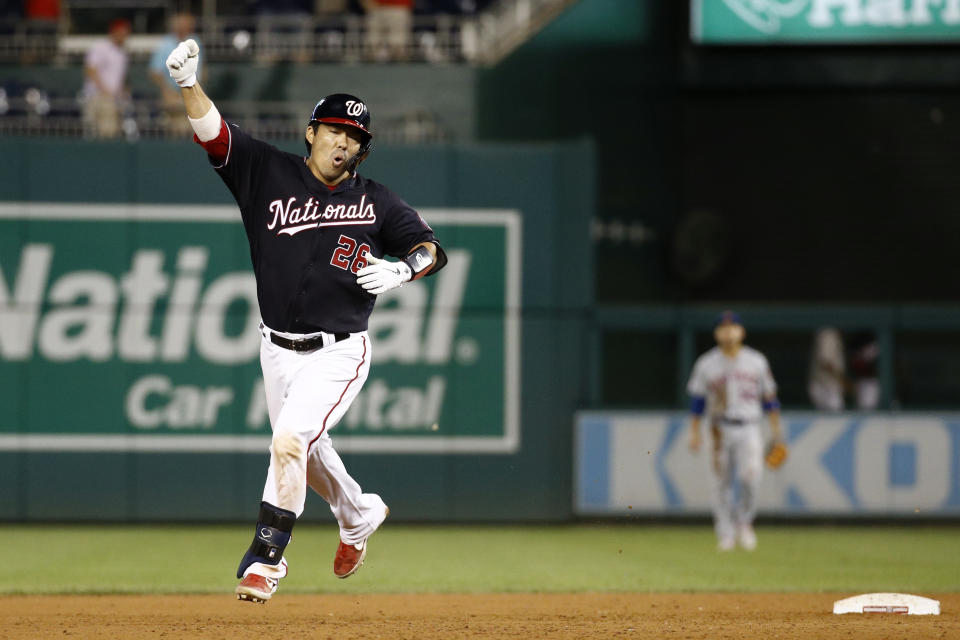 Washington Nationals' Kurt Suzuki celebrates as he rounds the bases after hitting a game-winning three-run home run in the team's baseball game against the New York Mets, Tuesday, Sept. 3, 2019, in Washington. Washington won 11-10. (AP Photo/Patrick Semansky)