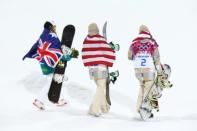 Silver medalist Torah Bright of Australia, gold medalist Kaitlyn Farrington of the US, and bronze medalist Kelly Clark of the US celebrate for the Snowboard Women's Halfpipe Finals