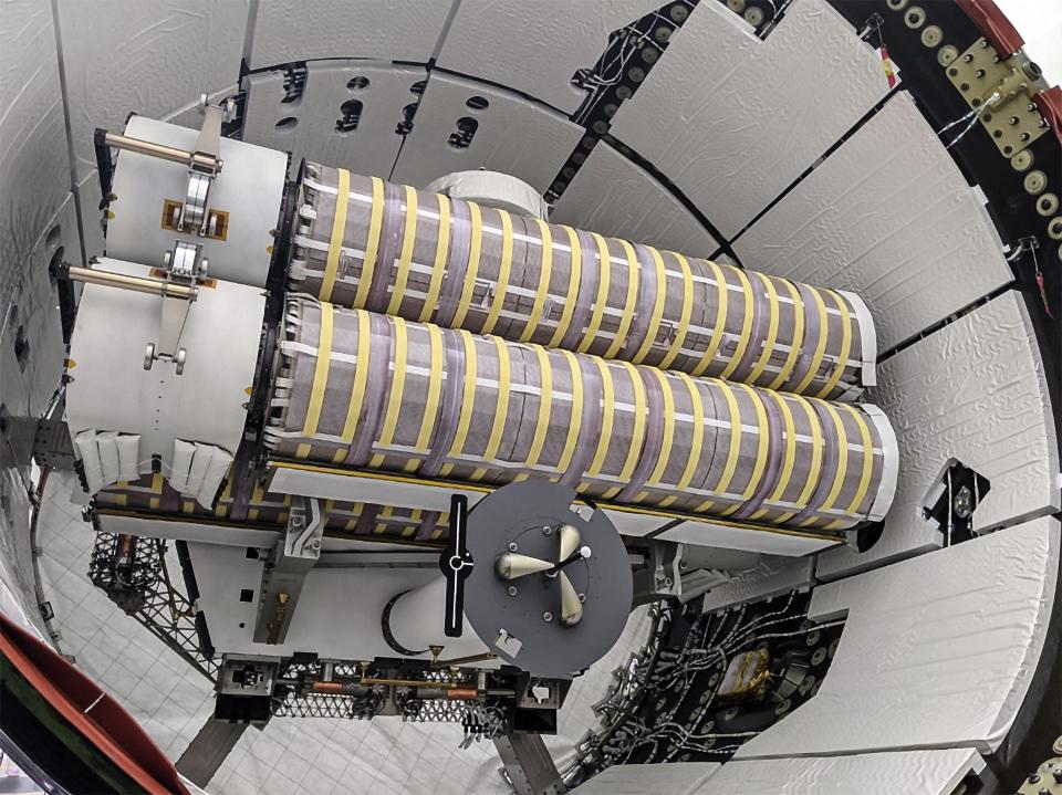 A pair of International Space Station Rollout Solar Arrays, or iROSA, are seen in Cargo Dragon's unpressurized "trunk" ahead of a SpaceX cargo resupply launch to the orbiting outpost. The new arrays will be installed by astronauts atop the station's old ones during upcoming spacewalks.
