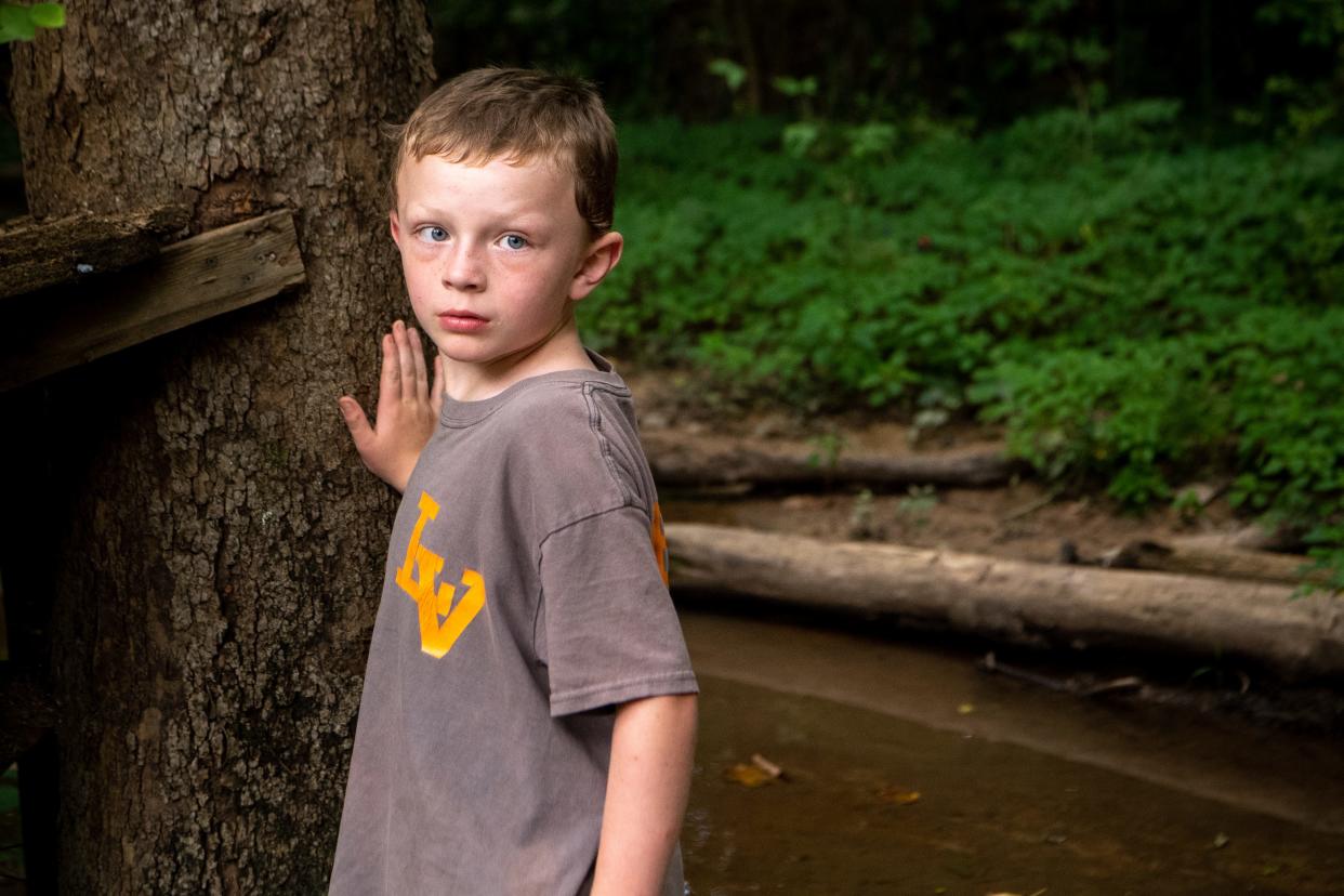 Abel Sewell, 6, who spent three years battling leukemia, looks to his mother at their home Monday, June 17, 2019, in Chattanooga. Abel is one of at least 220,000 Tennessee children who lost or were slated to lose state insurance due to lacking paperwork in recent years.