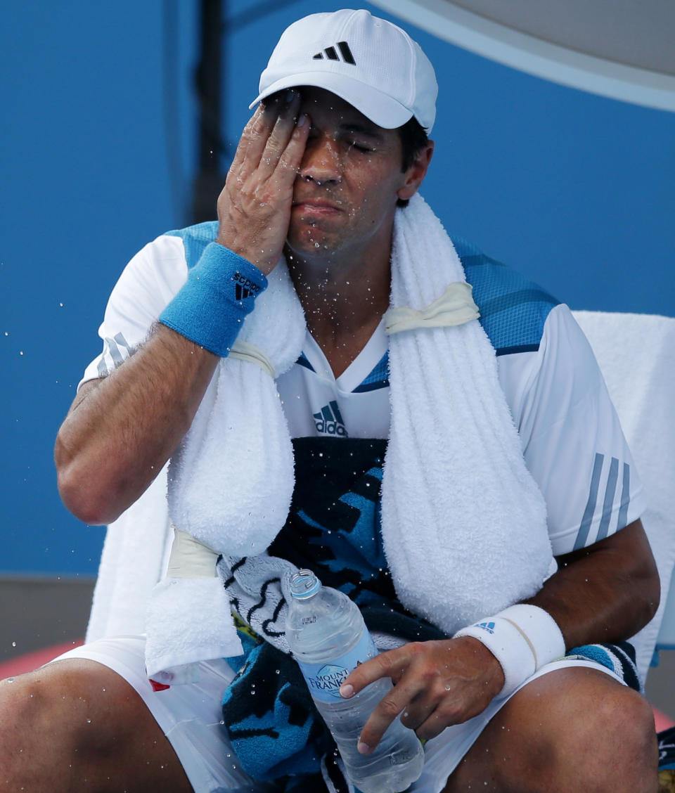 Fernando Verdasco of Spain cools down during his first round match against Zhang Ze of China at the Australian Open tennis championship in Melbourne, Australia, Tuesday, Jan. 14, 2014. (AP Photo/Aaron Favila)