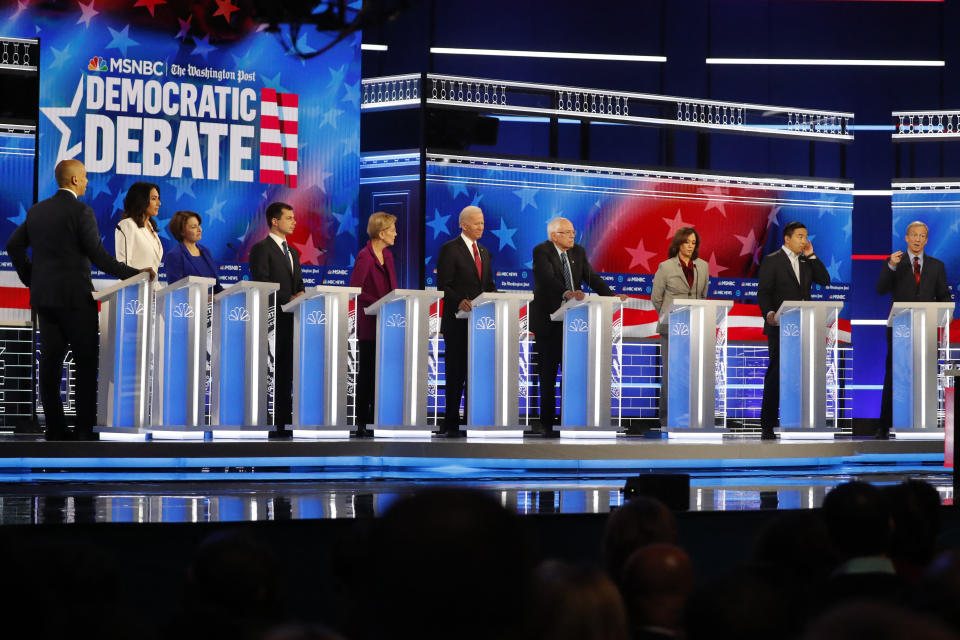 Democratic presidential candidates from left, Sen. Cory Booker, D-N.J., Rep. Tulsi Gabbard, D-Hawaii, Sen. Amy Klobuchar, D-Minn., South Bend, Ind., Mayor Pete Buttigieg, Sen. Elizabeth Warren, D-Mass., former Vice President Joe Biden, Sen. Bernie Sanders, I-Vt., Sen. Kamala Harris, D-Calif., former technology executive Andrew Yang and investor Tom Steyer participate in a Democratic presidential primary debate, Nov. 20, 2019, in Atlanta. (Photo: John Bazemore/AP)