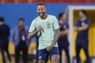 Brazil's Neymar smiles during a training session at the Grand Hamad stadium in Doha, Qatar, Sunday, Dec. 4, 2022. Brazil will face South Korea in a World Cup round of 16 soccer match on Dec. 5. (AP Photo/Andre Penner)