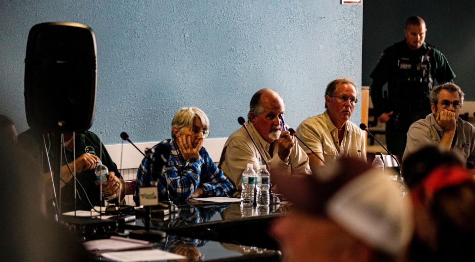 Members of the  Fort Myers Beach town council listen to residents during a meeting at the old Skip One building on San Carlos Boulevard on Thursday, Oct. 20, 2022. It was first town council meeting since Hurricane Ian made landfall. It was an emotionally charged meeting with some residents showing frustration about the response.  