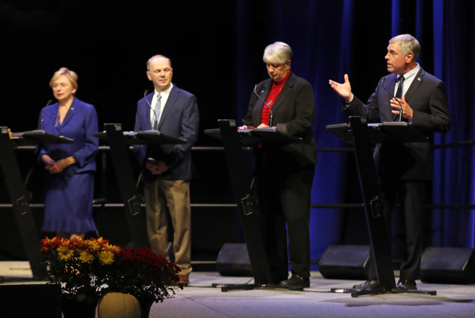 Maine gubernatorial candidate Republican Shawn Moody, far right, speaks during a debate with fellow candidates Democrat Janet Mills, far left, Independent Alan Caron, second from left, and Independent Teresea Hayes, and Wednesday, Oct. 17, 2018, at the Augusta Civic Center in Augusta, Maine. (AP Photo/Robert F. Bukaty)