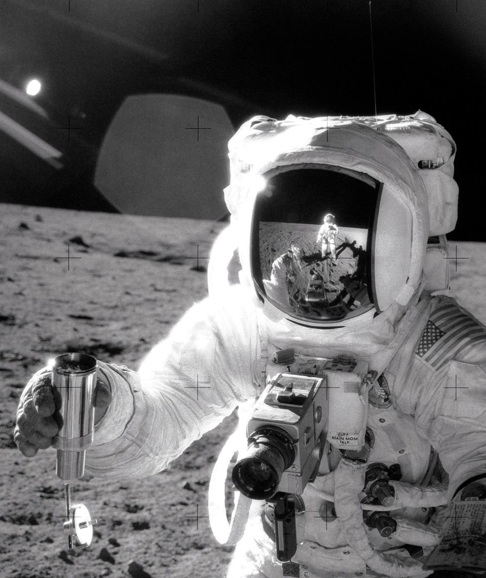 Pete Conrad is reflected in Al Bean’s visor as they stand on the moon together in 1969 - getty