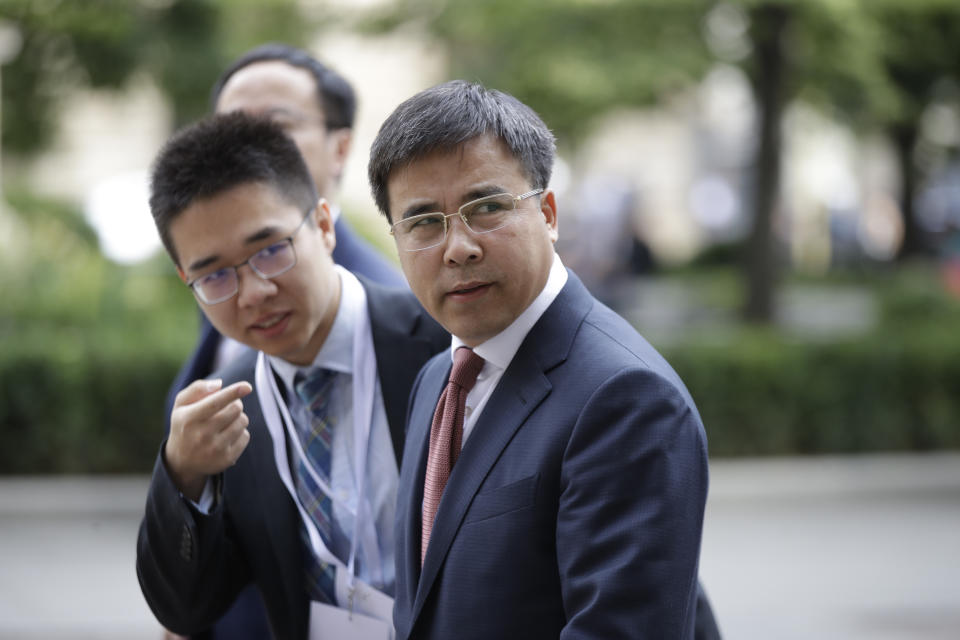 Bank of China chairman, Liu Liange, arrives on the occasion of the Italy-China Financial forum, at Palazzo Marino town hall, in Milan, Italy, Wednesday, July 10, 2019. (AP Photo/Luca Bruno)