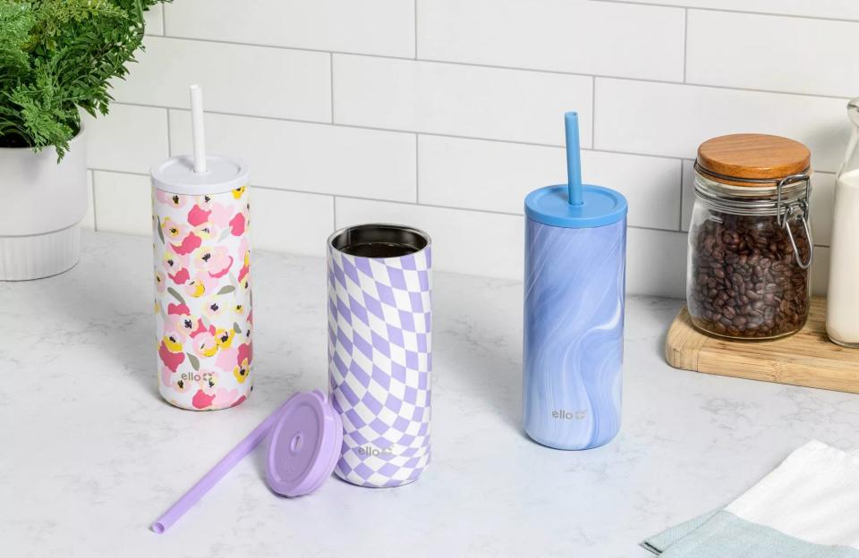 The tumbler with lid and straw in floral, check, and marble designs