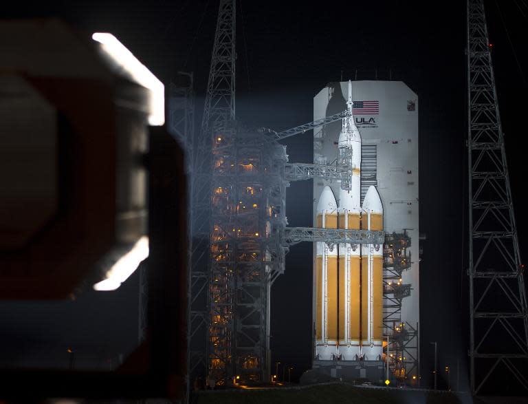 A United Launch Alliance Delta IV Heavy rocket with NASA's Orion spacecraft mounted atop is seen on Thursday, December 4, 2014, at Cape Canaveral Air Force Station's Space Launch Complex 37 in Florida