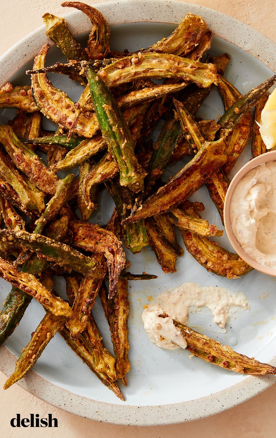 <p>Okra has a unique taste, which lands somewhere between grassy and nutty. It's ideal in fried—or <em>air-fried</em>—preparations because the richness of oil balances okra's vegetal notes. Here we toss the long, slender green pods with a <a href="https://www.delish.com/cooking/recipe-ideas/a26258870/cajun-seasoning-spice-recipe/" rel="nofollow noopener" target="_blank" data-ylk="slk:Cajun;elm:context_link;itc:0;sec:content-canvas" class="link ">Cajun</a>-spiced cornstarch coating to make them extra crispy. Serve with your favorite vegan sour cream or mayonnaise-based sauce to cool off the spice.</p><p>Get the <strong><a href="https://www.delish.com/cooking/recipe-ideas/a39740876/air-fryer-okra-recipe/" rel="nofollow noopener" target="_blank" data-ylk="slk:Air Fryer Okra recipe;elm:context_link;itc:0;sec:content-canvas" class="link ">Air Fryer Okra recipe</a></strong>. </p>