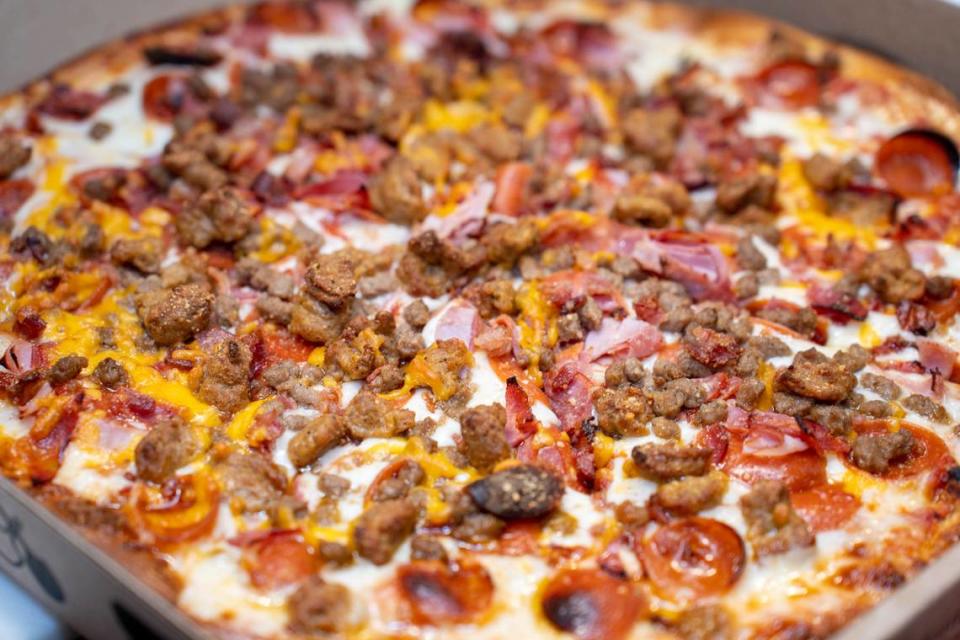 Bisonte Pizza Co.’s Meat Lovers pizza has pepperoni, ham, capicola, sausage, ground beef and bacon on top of a three-cheese mix of mozzarella, cheddar and romano with pizza sauce.