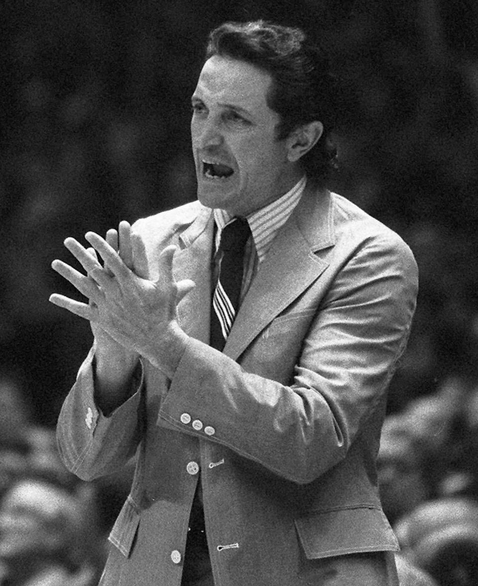 Al McGuire, then Marquette basketball coach, shouts to his team during their NCAA semifinal game against Kansas in Greensboro, N.C., on March 23, 1974.