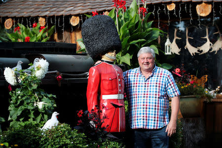 Gary Blackburn, a 53-year-old tree surgeon from Lincolnshire, Britain, poses with a model of the Queen's Coldstream Guard at his British curiosities collection called "Little Britain" in Linz-Kretzhaus, south of Germany's former capital Bonn, Germany, September 4, 2017. REUTERS/Wolfgang Rattay