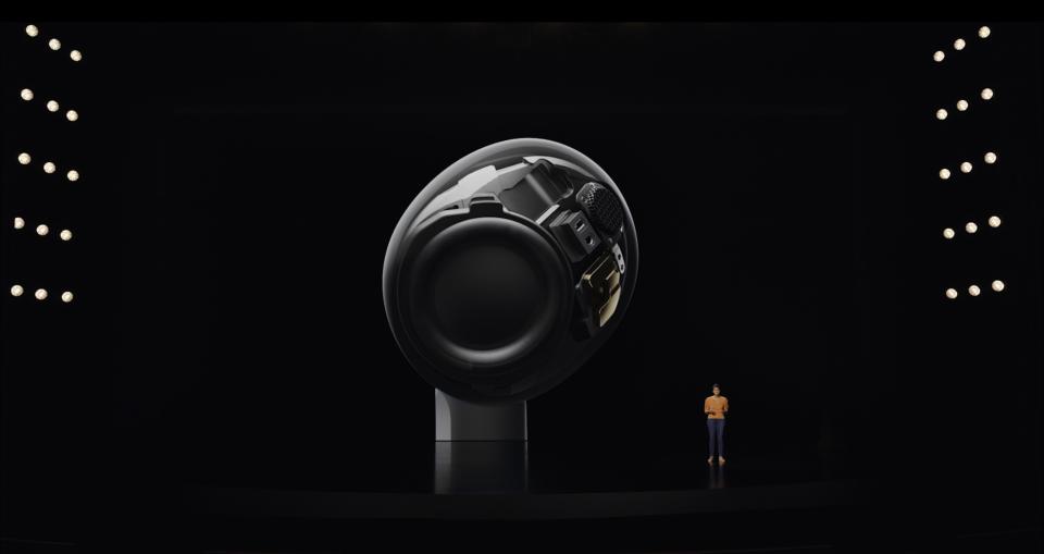 A cross section of the AirPods 3 driver at an Apple presentation with the presenter in the corner of the screen