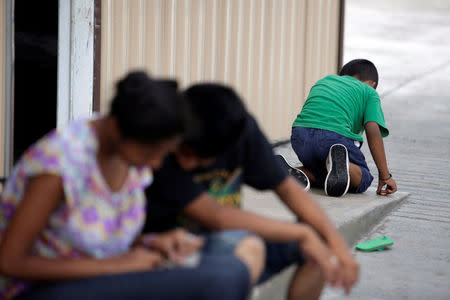 Salvadoran migrant children are seen at the Senda de Vida migrant shelter in Reynosa, in Tamaulipas state, Mexico June 22, 2018. Picture taken June 22, 2018. REUTERS/Daniel Becerril