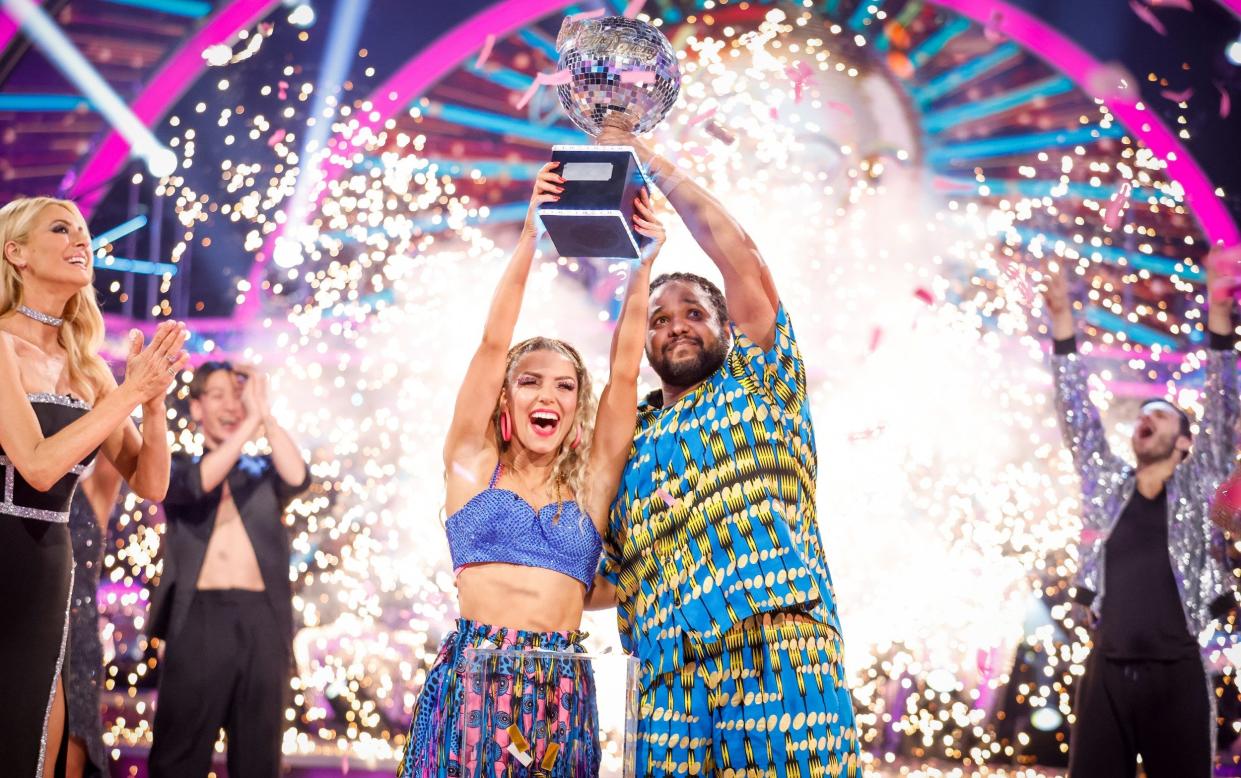 Strictly Come Dancing series 20 winners Hamza Yassin and Jowita Przystal lift the glitterball trophy - Guy Levy/BBC
