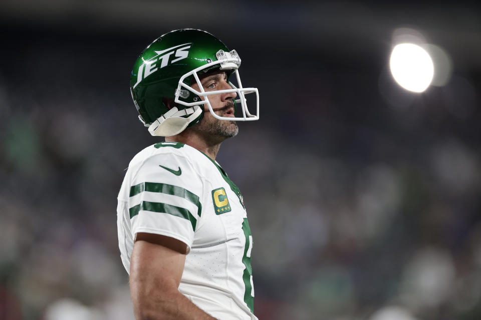 Aaron Rodgers was carted off the field just four plays into his debut with the Jets on Monday night