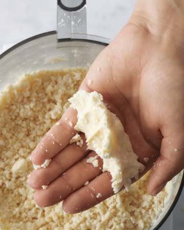 <div class="caption-credit"> Photo by: Martha Stewart Living</div><div class="caption-title">The Dough Should Look Like This When You Squeeze It</div><b>The Dough Should Look Like This When You Squeeze It</b> <br> With this method, there is no guesswork for the amount of water. The dough should remain crumbly but come together when pressed. Don't pulse it so long that it forms a ball. If it does, it's overworked. <br> <br> Plus: <a rel="nofollow noopener" href="http://www.marthastewart.com/274408/rolling-out-piecrust/@center/276949/everything-thanksgiving?xsc=shine_ms_piecrust101" target="_blank" data-ylk="slk:Rolling Out Piecrust;elm:context_link;itc:0;sec:content-canvas" class="link ">Rolling Out Piecrust</a> <br>