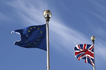 A British Union flag and an European Union flag are seen flying above offices in London, Britain, March 30, 2016. REUTERS/Toby Melville