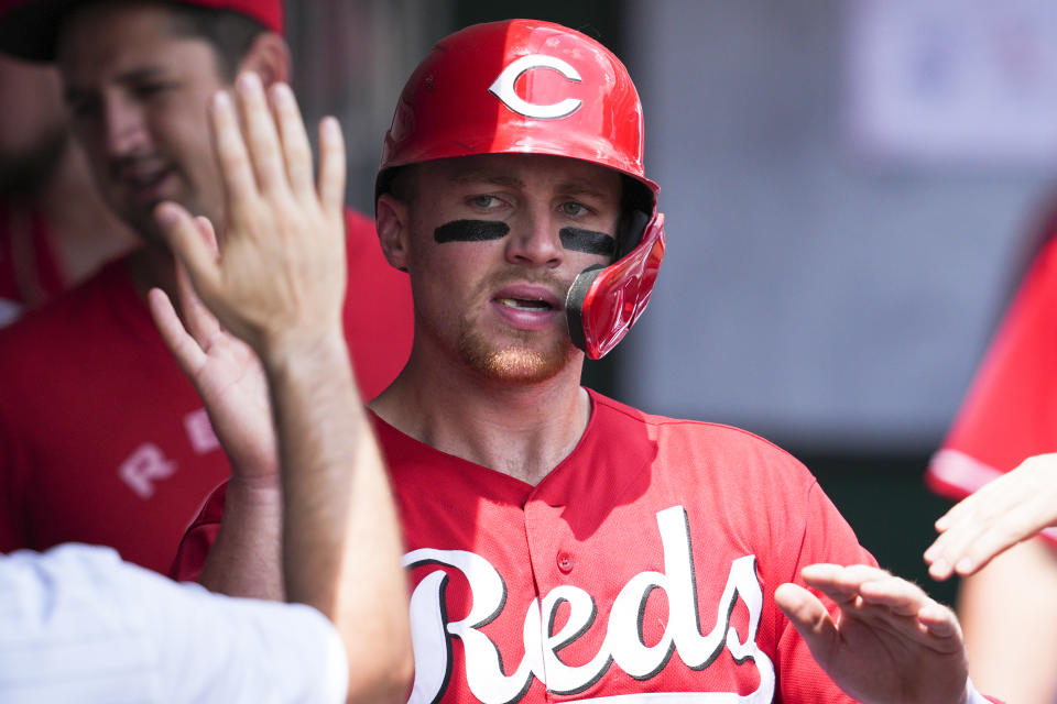 Cincinnati Reds' Brandon Drury celebrates with teammates after scoring on a Tommy Pham double during the first inning of a baseball game against the Miami Marlins, Thursday, July 28, 2022, in Cincinnati. (AP Photo/Jeff Dean)