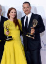 Julianne Moore, winner Outstanding Lead Actress in a Miniseries or a Movie for "Game Change," and producer Tom Hanks, winner Outstanding Miniseries or TV Movie for "Game Change," pose in the press room at the 64th Primetime Emmy Awards at the Nokia Theatre in Los Angeles on September 23, 2012.