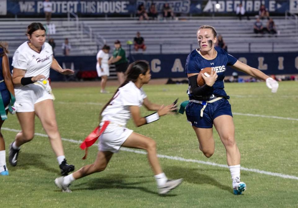 Central Catholic quarterback Marie Wlidenberg (7) runs the ball during the flag football game between Central Valley and Central Catholic at Central Catholic High School in Modesto , Calif., Thursday, August 24, 2023. Central Catholic won the game 34-14.