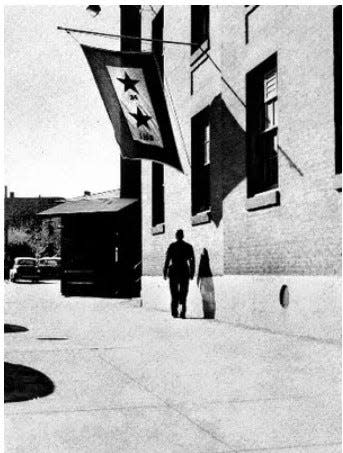 This flag at York Corporation's plant shows that 24 Gold-Star employees lost their lives in World War II through V-E Day, May 1945. That total included Chester F. Marshall. At that point, 1,148 employees had served in the military, later adjusted to 1,200. Thomas Frutiger’s death in the Philippines became known in the summer of 1945, raising the loss of life among York Corporation’s ranks at 25.