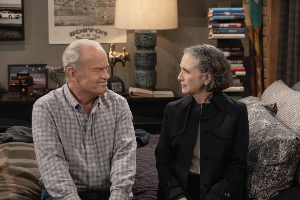 L-R: Kelsey Grammer as Frasier Crane and Bebe Neuwirth as Dr. Lilith Sternin moments before they share a kiss in <em>Frasier</em>