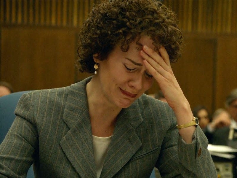 Sarah Paulson as Marcia Clark with hand on her head, crying