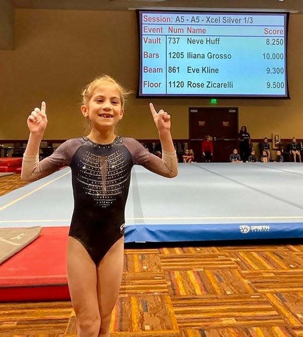 Eight-year-old Iliana Grosso is all smiles after recording the first perfect 10 in the history of Balance Gymnastics.