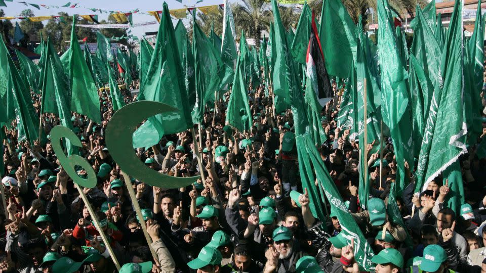 Hamas supporters, carrying the Islamist movement's green flags, take part in an election campaign rally in Gaza City ahead of the 2006 Palestinian parliamentary elections. - Mohammed Abed/AFP/Getty Images