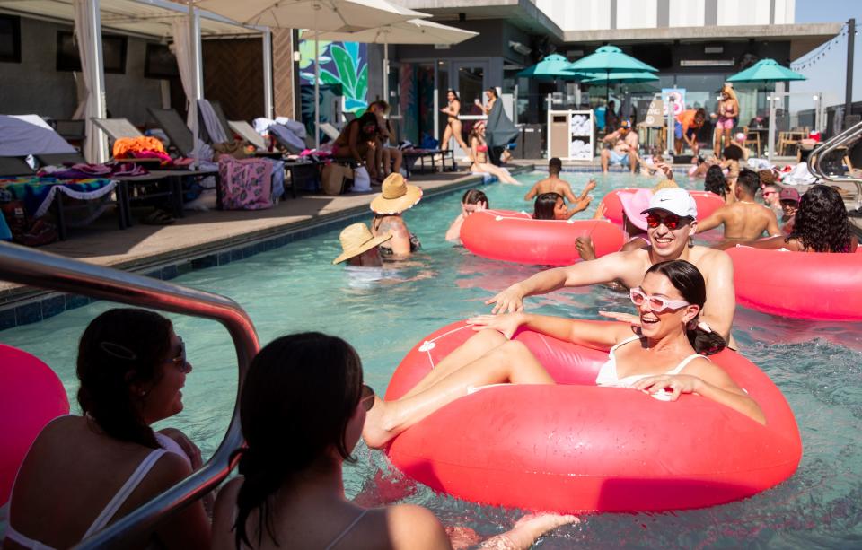 People attend Barbie's summer beach house pool party at the Alibi Rooftop Lounge in Tempe on July 15, 2023.