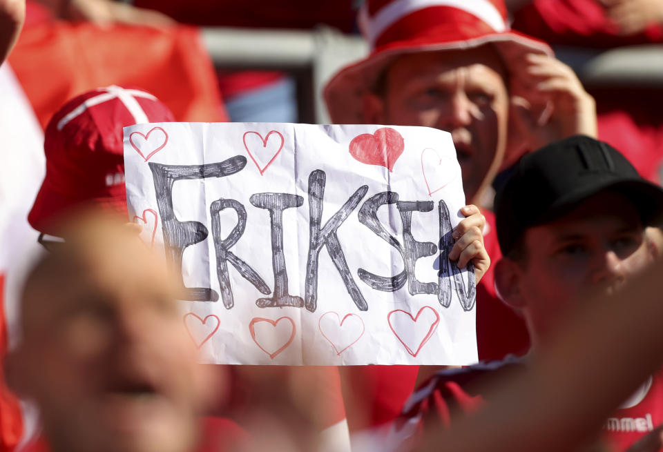 Danish supporters show a sign referring to Denmark's Christian Eriksen during the Euro 2020 soccer championship group B match between Denmark and Belgium at Parken stadium in Copenhagen, Thursday, June 17, 2021. (Friedemann Vogel/Pool via AP)