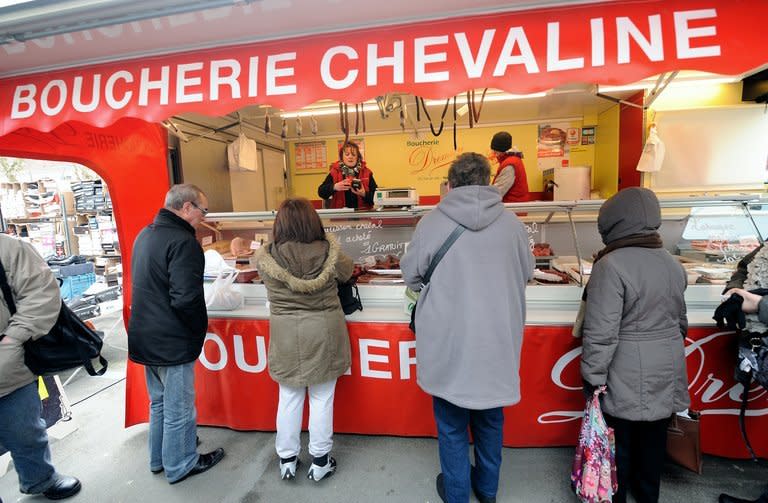 Customers queue at a horsemeat butcher in Anzin, northern France, on February 22, 2013. Three carcasses containing phenylbutazone "probably" made it to consumers, but there was "no health risk" since the traces of the drug found in the meat were "extremely weak," said Agriculture Minister Stephane Le Foll