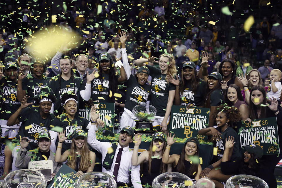 FILE - Baylor women's basketball team celebrate their tenth-straight Big 12 regular season championship following an NCAA college basketball game against Kansas State in Waco, texas, in this Saturday, Feb. 29, 2020, file photo. The Bears are No. 7 in The Associated Press’ preseason Top 25 and still are favored to win the conference title under new coach Nicki Collen. (AP Photo/Rod Aydelotte, File)